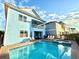 Private pool and spa with lounge chairs and backyard view at 3088 Parrot Head Pl, Kissimmee, FL 34747