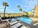 Private pool and spa with lounge chairs and backyard view at 3088 Parrot Head Pl, Kissimmee, FL 34747