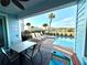 Relaxing pool area with patio furniture and grill at 3088 Parrot Head Pl, Kissimmee, FL 34747