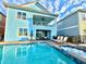 Private pool and spa with lounge chairs and outdoor patio furniture at 3088 Parrot Head Pl, Kissimmee, FL 34747