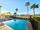 Inviting, refreshing pool with spa and lake view at 3088 Parrot Head Pl, Kissimmee, FL 34747