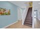 Elegant staircase with dark wood steps and light walls at 3088 Parrot Head Pl, Kissimmee, FL 34747