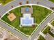 Birds-eye view of a community swimming pool and play area with manicured landscaping and parking at 3564 Fort Mellon Ln, Sanford, FL 32773