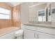 Updated bathroom with granite vanity and neutral tile at 3846 Long Grove Ln, Port Orange, FL 32129