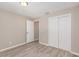Bright bedroom with laminate flooring and double door closet at 3846 Long Grove Ln, Port Orange, FL 32129