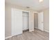 Bedroom with double-door closet and wood-look floors at 3846 Long Grove Ln, Port Orange, FL 32129