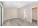 Spacious bedroom with wood-look floors and en-suite bathroom at 3846 Long Grove Ln, Port Orange, FL 32129