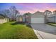 Two-story house with a large yard and attached garage at 3846 Long Grove Ln, Port Orange, FL 32129