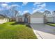 Two-story house with a grassy lawn and driveway at 3846 Long Grove Ln, Port Orange, FL 32129