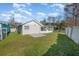 Backyard view of the house with a screened porch at 3846 Long Grove Ln, Port Orange, FL 32129
