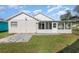 Exterior view of the house with a screened porch at 3846 Long Grove Ln, Port Orange, FL 32129