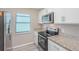Updated kitchen features granite countertops and stainless steel appliances at 3846 Long Grove Ln, Port Orange, FL 32129