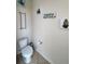 Functional powder room featuring a toilet, and decorated wall at 430 Captiva Dr, Davenport, FL 33896