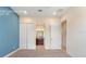 Bedroom with double doors leading to bathroom at 430 Captiva Dr, Davenport, FL 33896