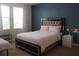 Comfortable bedroom with natural light from large windows at 430 Captiva Dr, Davenport, FL 33896