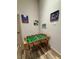 Indoor recreation room with a foosball table and framed art pieces on the walls at 430 Captiva Dr, Davenport, FL 33896