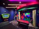 Fun game room featuring a pool table, neon lighting, retro decor, and a vibrant entertainment space at 430 Captiva Dr, Davenport, FL 33896