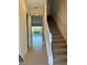 Inviting hallway with staircase leading to a pool and a bright living area at 430 Captiva Dr, Davenport, FL 33896