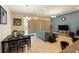 Open-concept living and dining area with modern furnishings and natural light at 430 Captiva Dr, Davenport, FL 33896