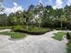 A mini golf course with artificial turf and decorative landscaping and a concrete pathway at 430 Captiva Dr, Davenport, FL 33896