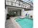 Inviting pool area with a screened-in lanai and comfortable seating at 430 Captiva Dr, Davenport, FL 33896