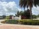 The Enclaves Amenity Center entrance sign surrounded by lush landscaping at 430 Captiva Dr, Davenport, FL 33896
