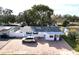 Single story home with paver driveway and mature tree in front at 5958 Lawnview Dr, Orlando, FL 32812