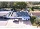 Single story home with paver driveway, surrounded by lush vegetation at 5958 Lawnview Dr, Orlando, FL 32812