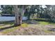 Large backyard with mature trees and open space at 5958 Lawnview Dr, Orlando, FL 32812
