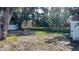 Large backyard with mature trees and open space at 5958 Lawnview Dr, Orlando, FL 32812