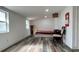 Simple bedroom with a double bed and light wood floors at 5958 Lawnview Dr, Orlando, FL 32812