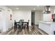 Dining area with table and chairs next to kitchen at 5958 Lawnview Dr, Orlando, FL 32812