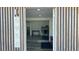 Open entryway with view into living area and kitchen at 5958 Lawnview Dr, Orlando, FL 32812