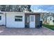 Updated house exterior with modern finishes and landscaping at 5958 Lawnview Dr, Orlando, FL 32812