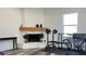 White brick fireplace with wood mantel in living room at 5958 Lawnview Dr, Orlando, FL 32812
