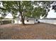 House exterior with white siding and large backyard at 5958 Lawnview Dr, Orlando, FL 32812