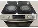 Stainless steel electric cooktop with four burners and a digital control panel at 5958 Lawnview Dr, Orlando, FL 32812