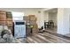 Living area with stacked boxes, table and chairs, and hardwood floors at 5958 Lawnview Dr, Orlando, FL 32812