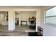Living room with fireplace, exercise equipment, and hardwood floors at 5958 Lawnview Dr, Orlando, FL 32812