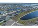 Aerial view of houses near a lake at 613 Greymount St, Davenport, FL 33837