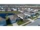 Aerial view of houses near a lake at 613 Greymount St, Davenport, FL 33837