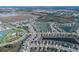 Wide aerial view of community with lake and park at 613 Greymount St, Davenport, FL 33837