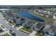 Aerial view of houses near a lake at 613 Greymount St, Davenport, FL 33837