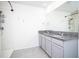Bathroom with double vanity and walk-in shower at 613 Greymount St, Davenport, FL 33837