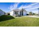 House exterior showcasing a well-maintained lawn and driveway at 613 Greymount St, Davenport, FL 33837