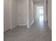 Bright hallway with tile floors and access to other rooms at 613 Greymount St, Davenport, FL 33837
