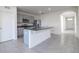 Modern kitchen with stainless steel appliances and granite countertops at 613 Greymount St, Davenport, FL 33837