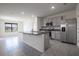 Modern kitchen with stainless steel appliances and granite countertops at 613 Greymount St, Davenport, FL 33837