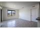 Open living area with tile floors and a window at 613 Greymount St, Davenport, FL 33837