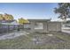 Spacious backyard with a view of a house and fence at 613 Ross St, Leesburg, FL 34748